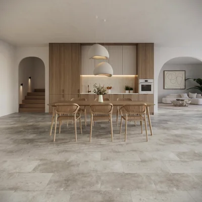 Open-plan kitchen with tall wood cabinetry, an island, built-in oven, and a wooden dining table with six wicker chairs; two large white pendant lights overhead.