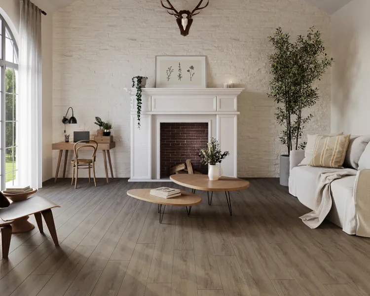Bright living room with a white brick fireplace, exposed timber beams, light oak floor, beige sofa, round coffee tables, and potted plants by a large window.