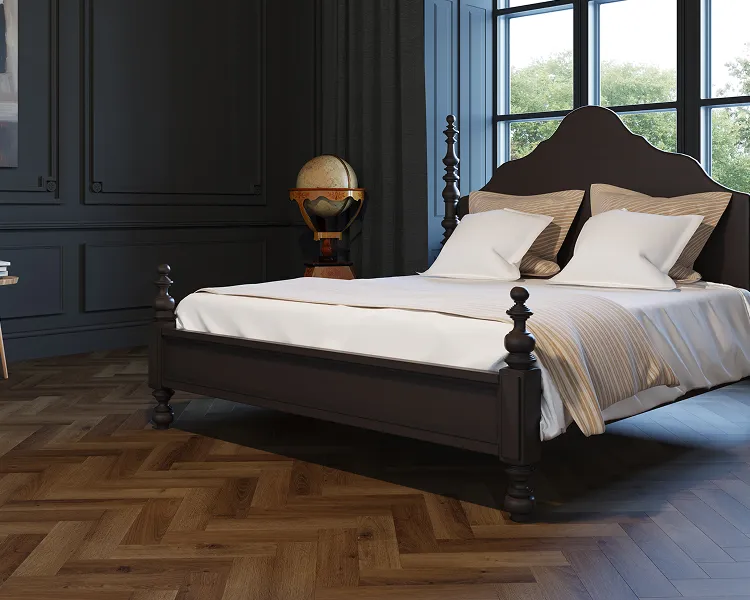 Dark four-poster bed with white linens and beige cushions in a paneled blue-grey bedroom; a globe on a stand near a large window, parquet floor.
